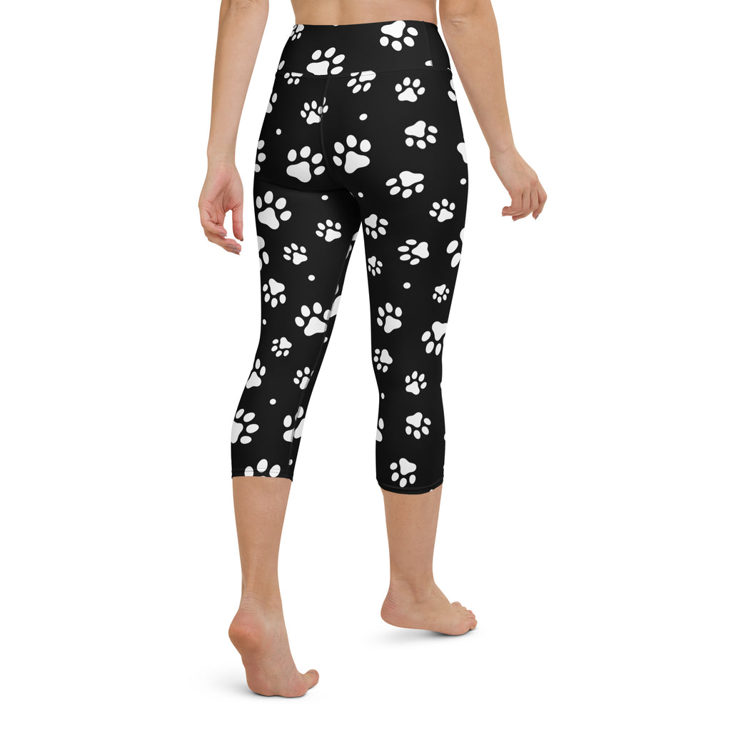 Black capri-length buttery soft yoga leggings with white paw print pattern high-rise moisture-wicking stretch