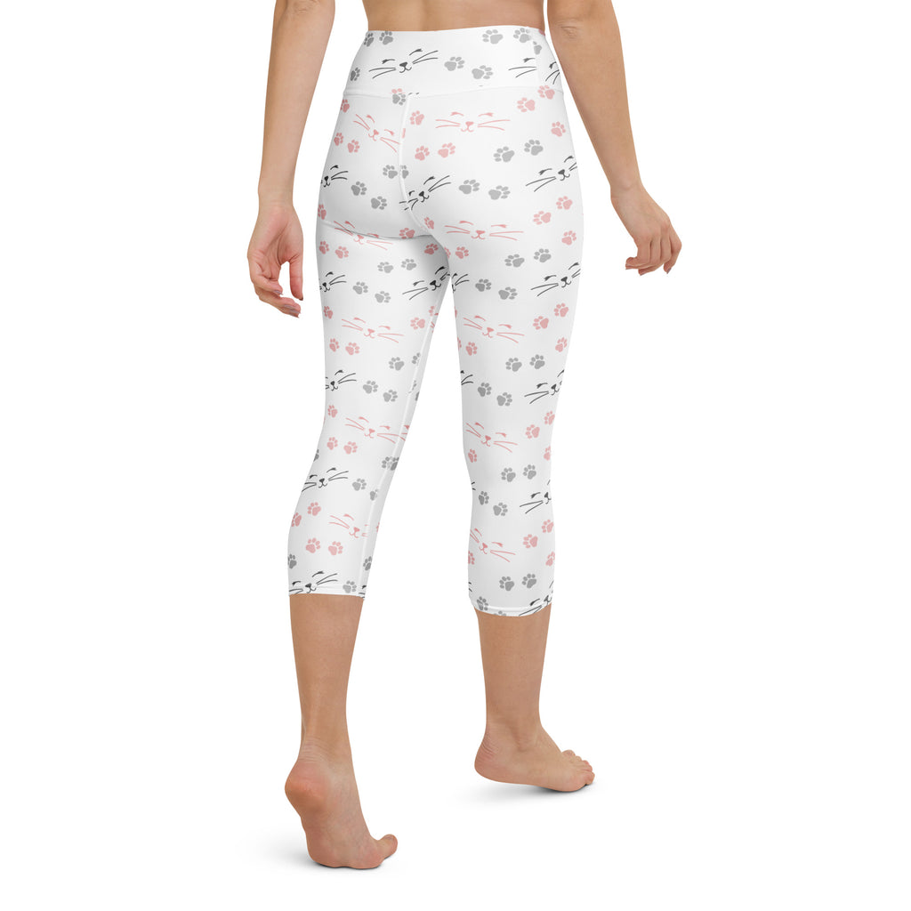 White capri leggings with black and pink cat faces whiskers and gray paw prints buttery soft moisture-wicking activewear