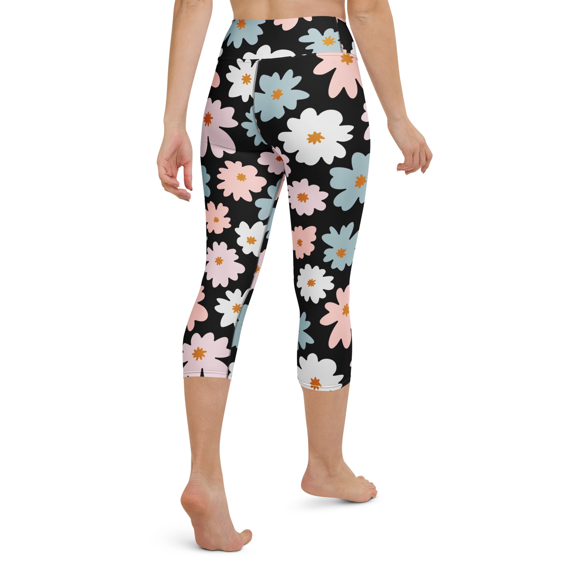 Women’s retro floral buttery soft black capri leggings with pink white blue daisies and orange centers high-rise activewear
