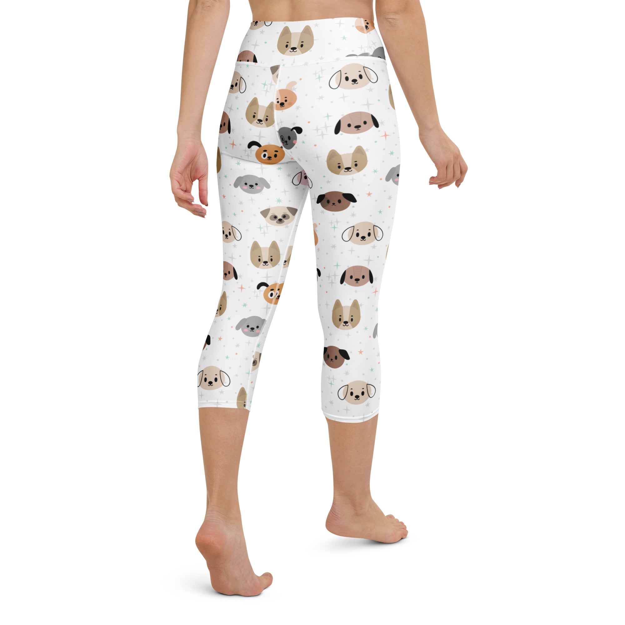 White capri leggings with high-rise fit featuring colorful cartoon dog faces in buttery soft moisture-wicking fabric