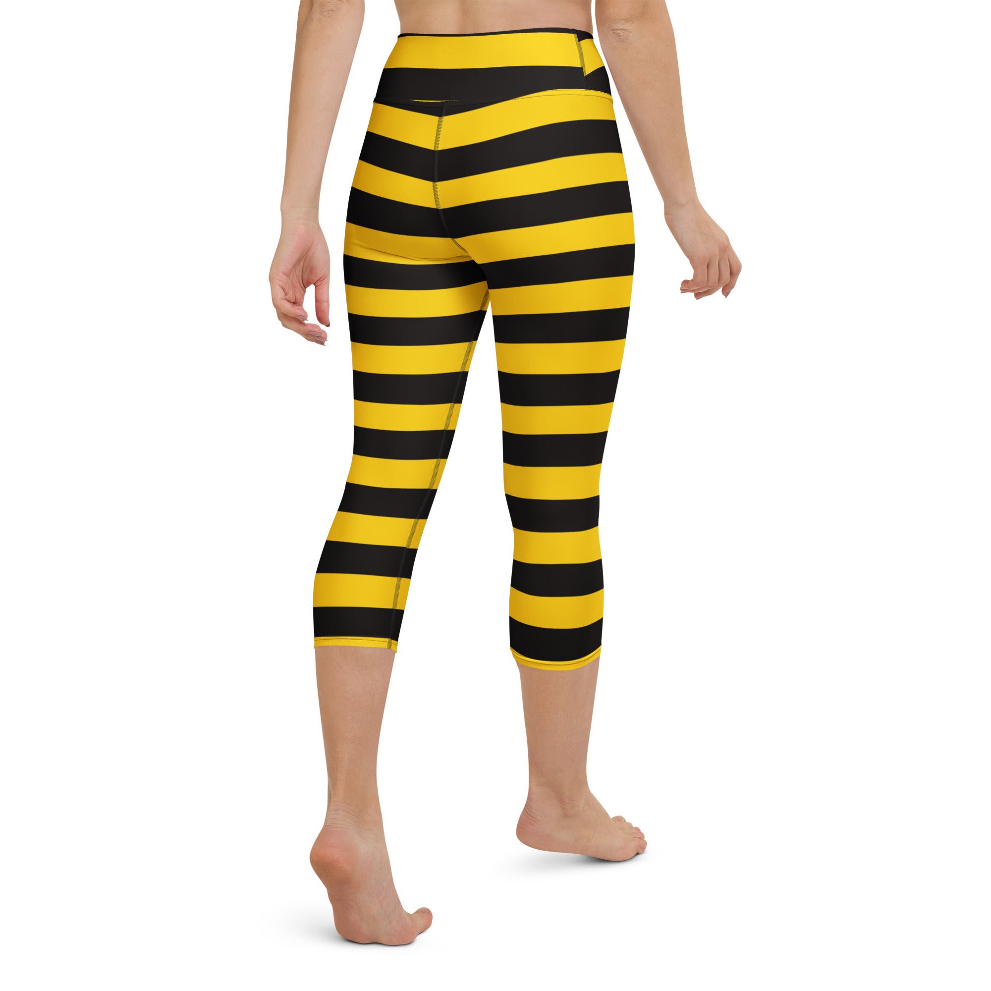 Women’s high-rise yellow and black striped buttery soft capri leggings for yoga with moisture-wicking stretch fabric