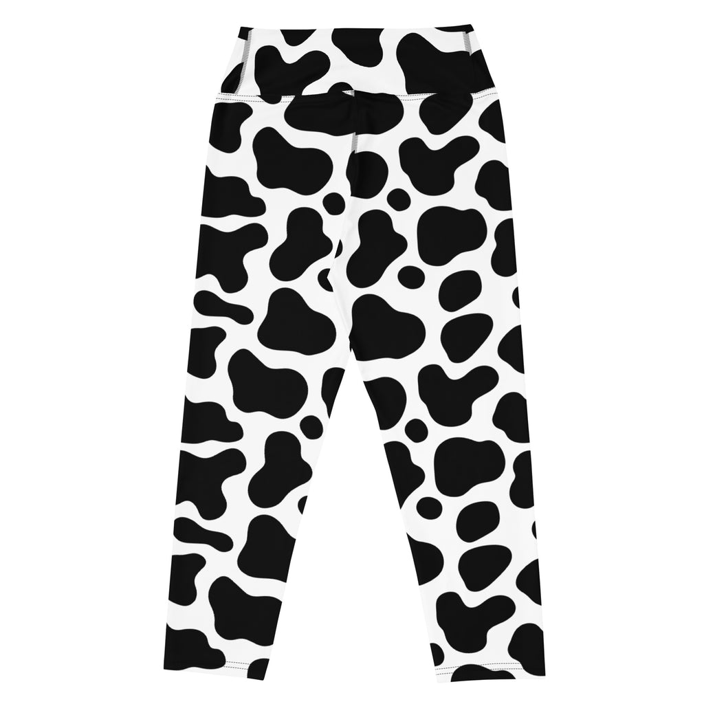 Women’s high-rise black and white cow print buttery soft yoga capri leggings with moisture-wicking stretch fabric