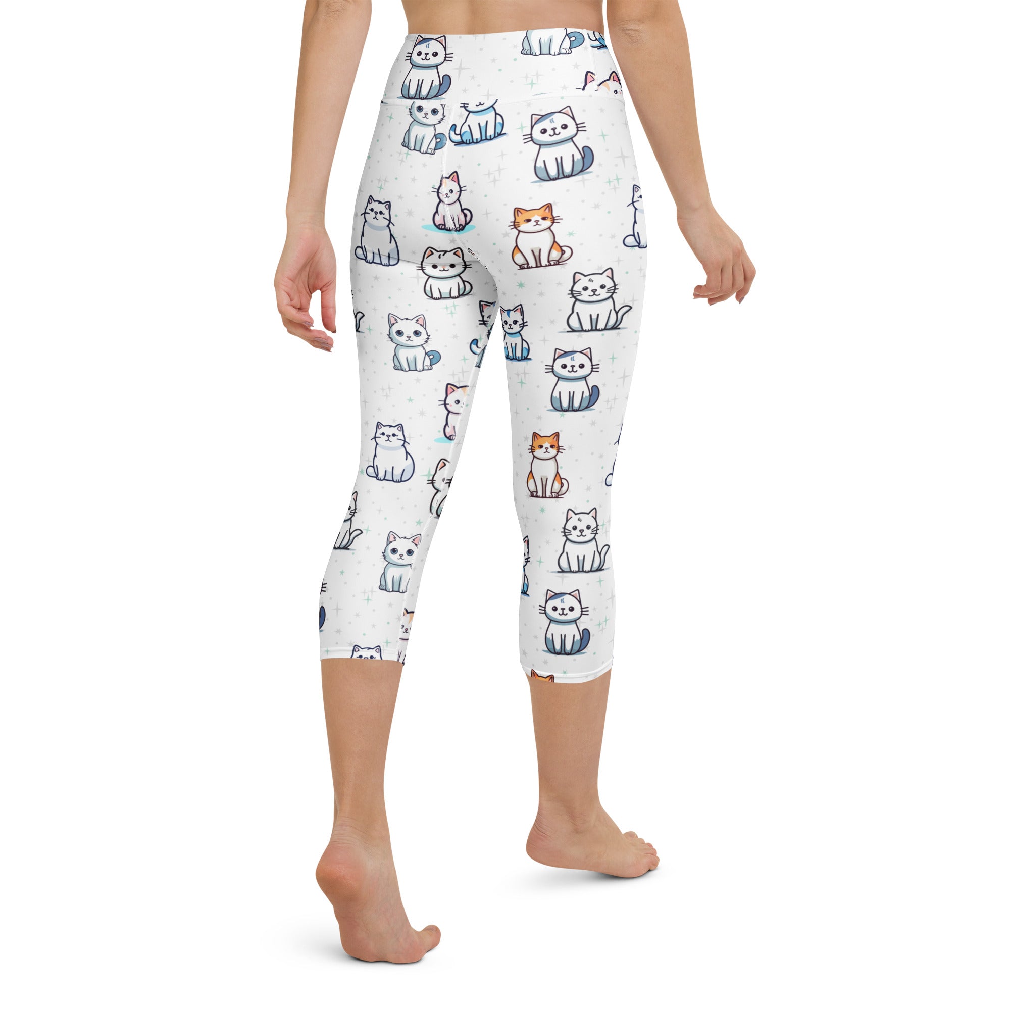 White capri leggings with a playful cartoon cat print in white gray blue and orange buttery soft high-rise yoga pants