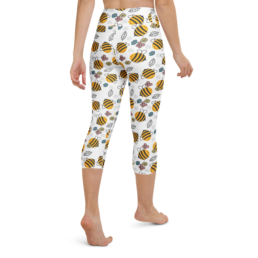 White high-rise capri leggings with yellow and black bee pattern green leaves soft stretch moisture-wicking material
