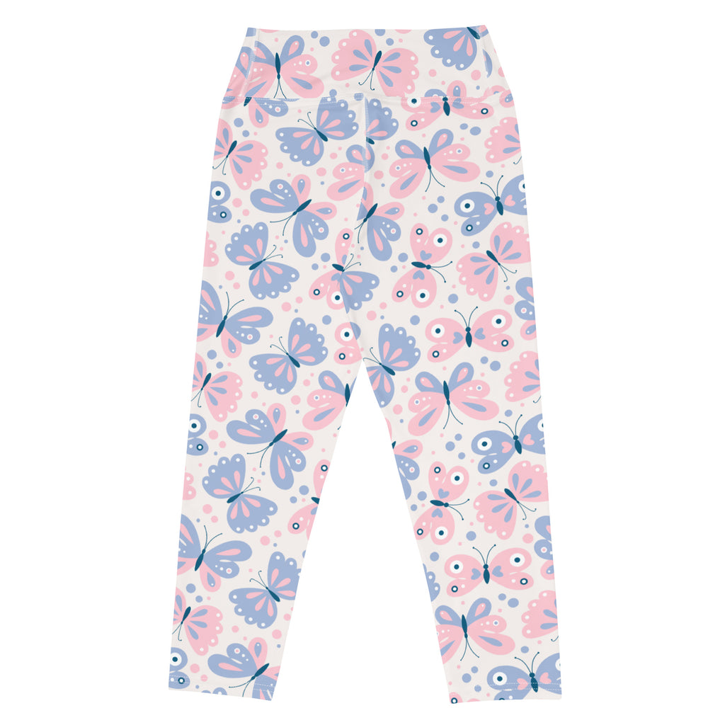 Women’s pastel butterfly buttery soft yoga capri leggings with pink and blue cartoonish pattern on light background