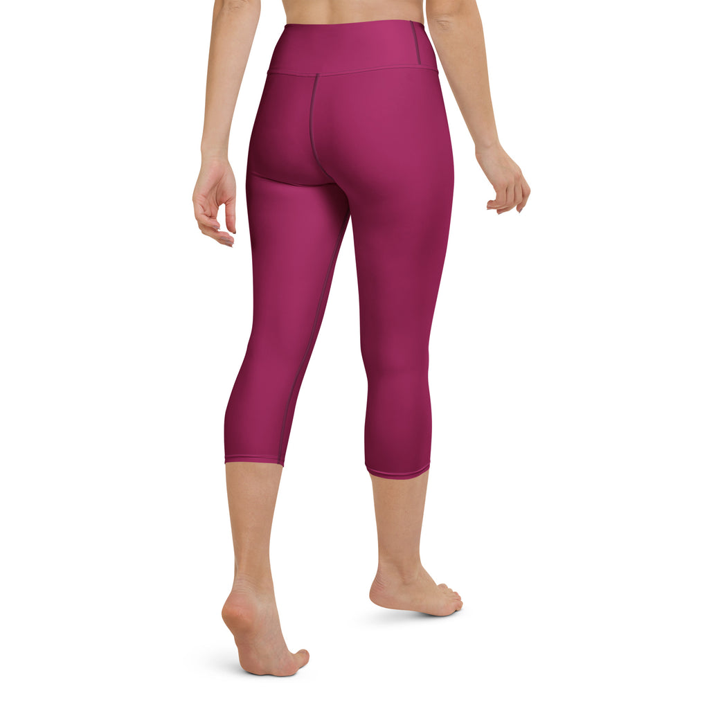 Women’s fuchsia high-rise buttery soft yoga capri leggings made of stretchy moisture-wicking fabric