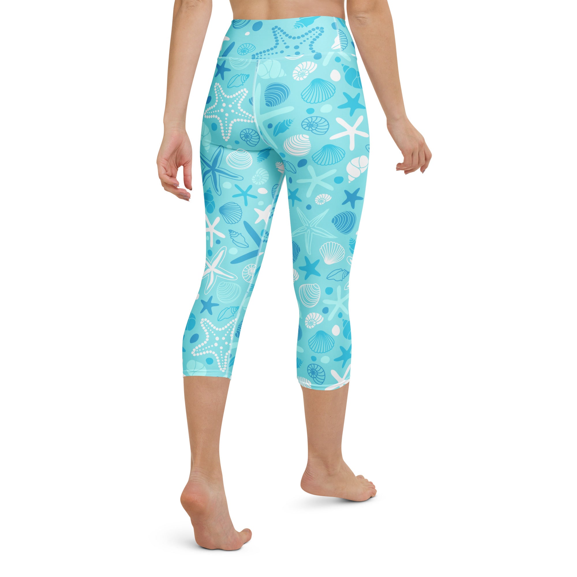 Light blue women’s high-rise buttery soft yoga capri leggings with white and dark blue starfish and seashell pattern
