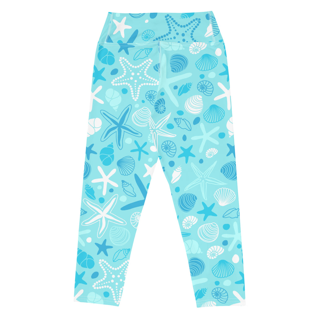 Women’s high-rise light blue buttery soft yoga capri leggings with playful white and dark blue starfish and shells pattern