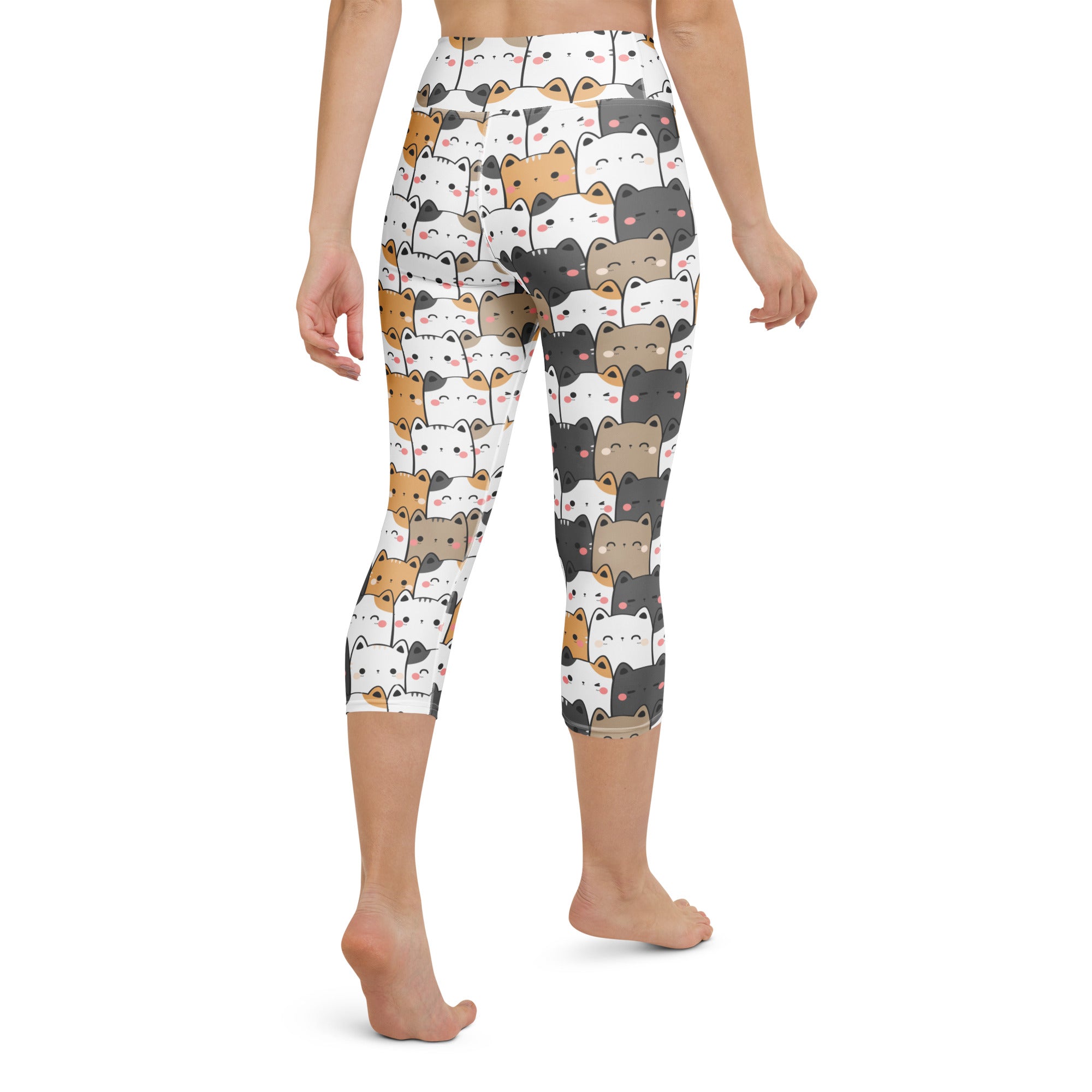 White capri leggings with a playful cartoon cat pattern in black white brown and gray buttery soft high-rise yoga pants