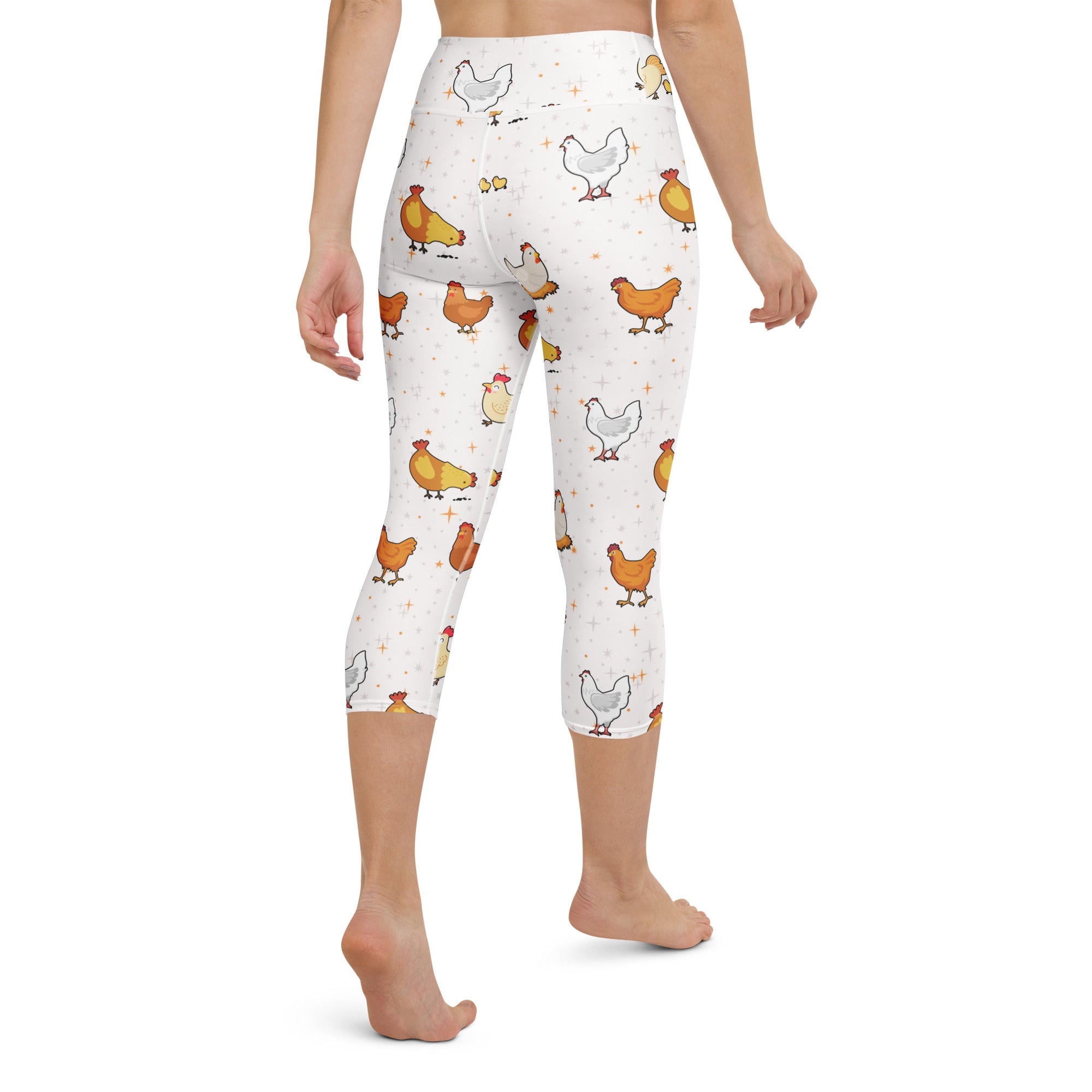 White high-rise capri leggings with orange white and yellow cartoon chickens soft stretch moisture-wicking fabric