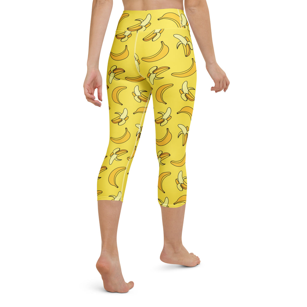Women’s yellow high-rise buttery soft capri leggings with playful cartoon banana pattern moisture-wicking