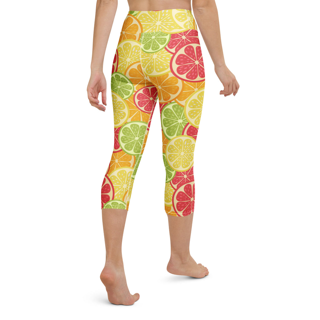 Women’s buttery soft high-rise capri leggings with brightly colored citrus fruit slice pattern for yoga and activewear