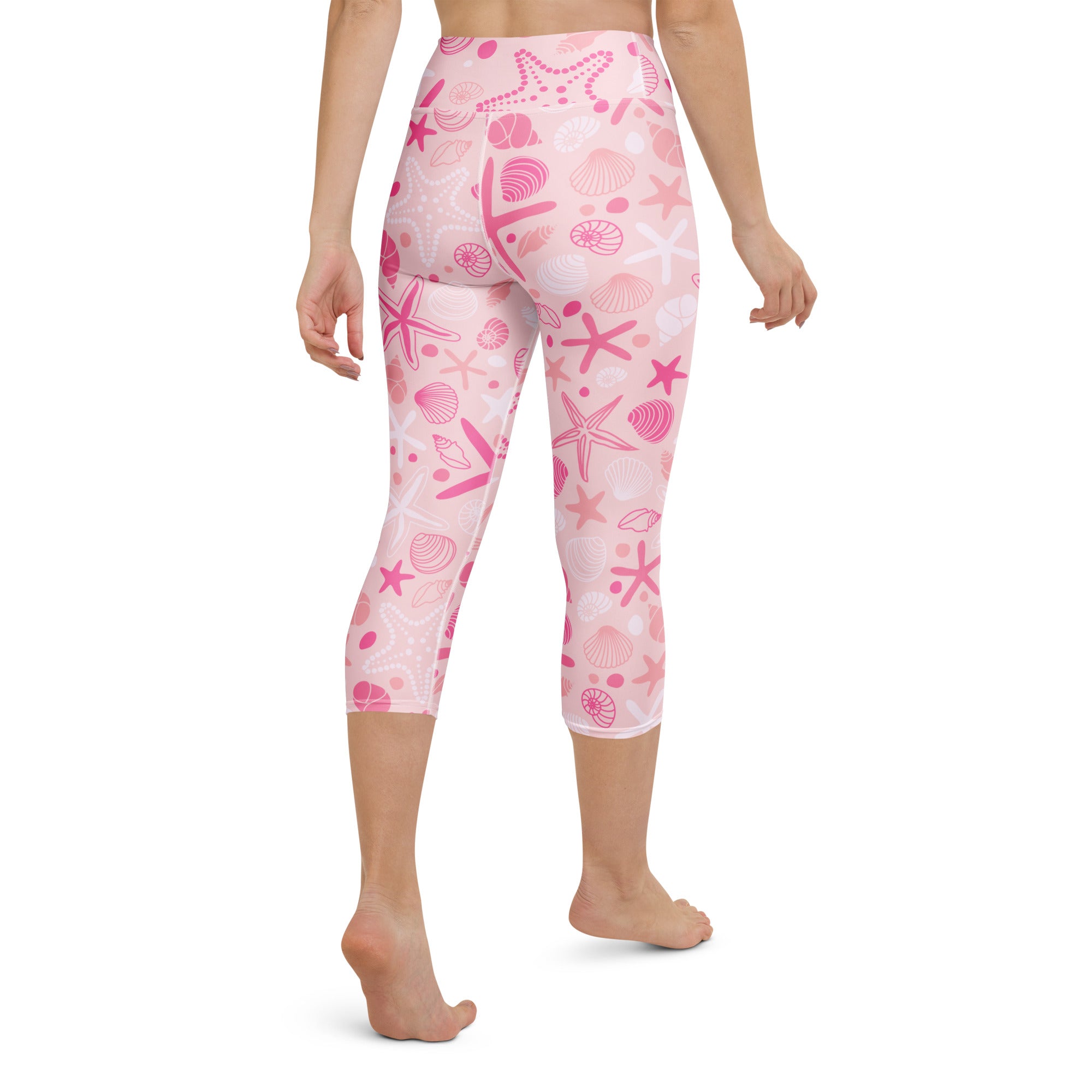 Women’s pink starfish and seashell patterned high-rise buttery soft yoga capri leggings with moisture-wicking fabric