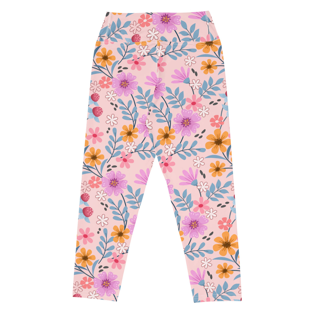 Women’s pink floral buttery soft yoga capri leggings with vibrant purple orange white flowers and blue leaf accents