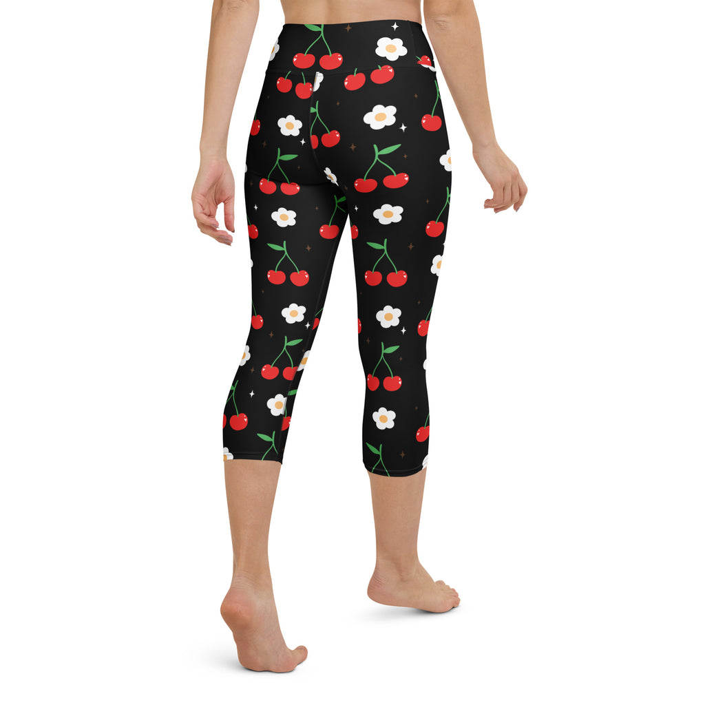 Women’s black cherry blossom buttery soft high-rise capri leggings with red cherries white daisies and green stems pattern