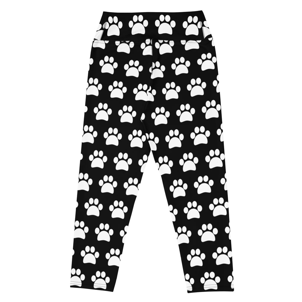 Women’s black buttery soft high-rise yoga capri leggings with white paw print pattern and moisture-wicking stretch
