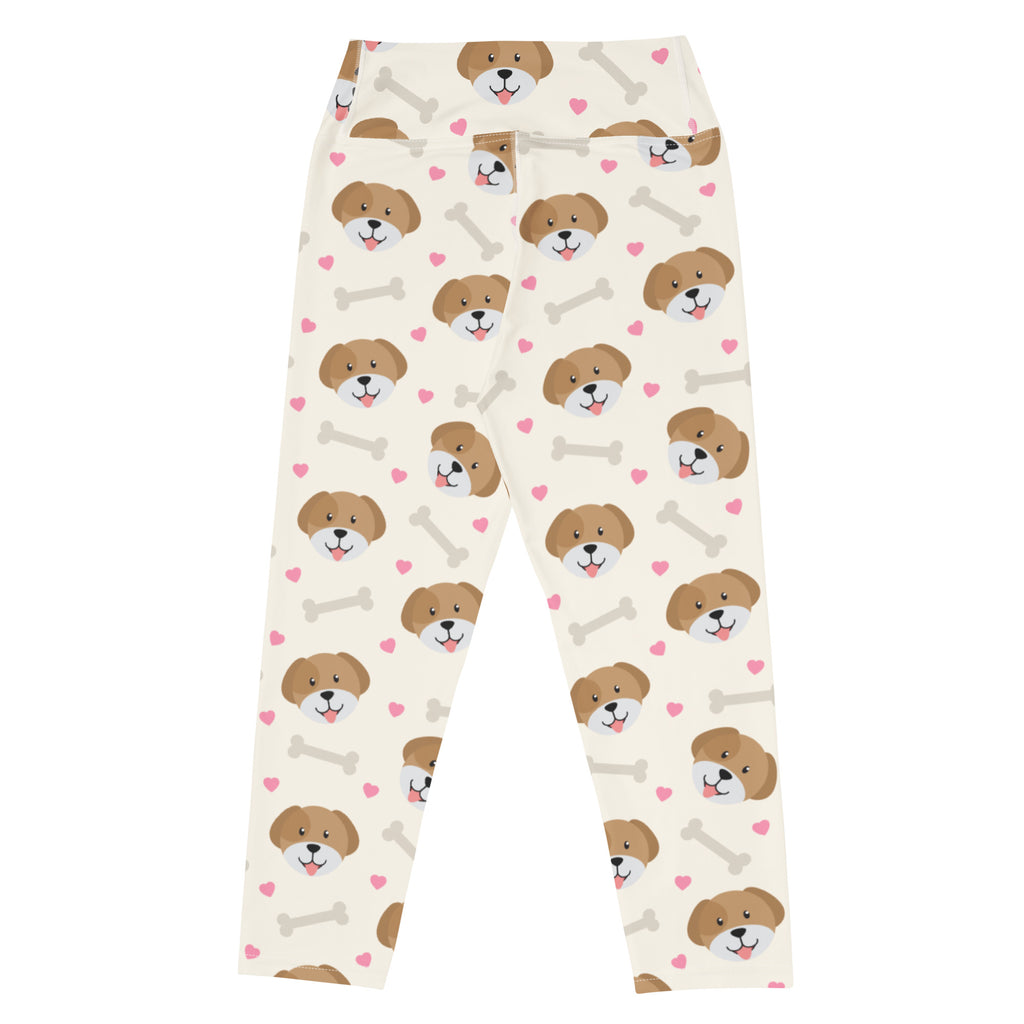 Cream-colored women’s puppy and bone buttery soft yoga capri leggings with brown puppy faces pink hearts and gray bones design