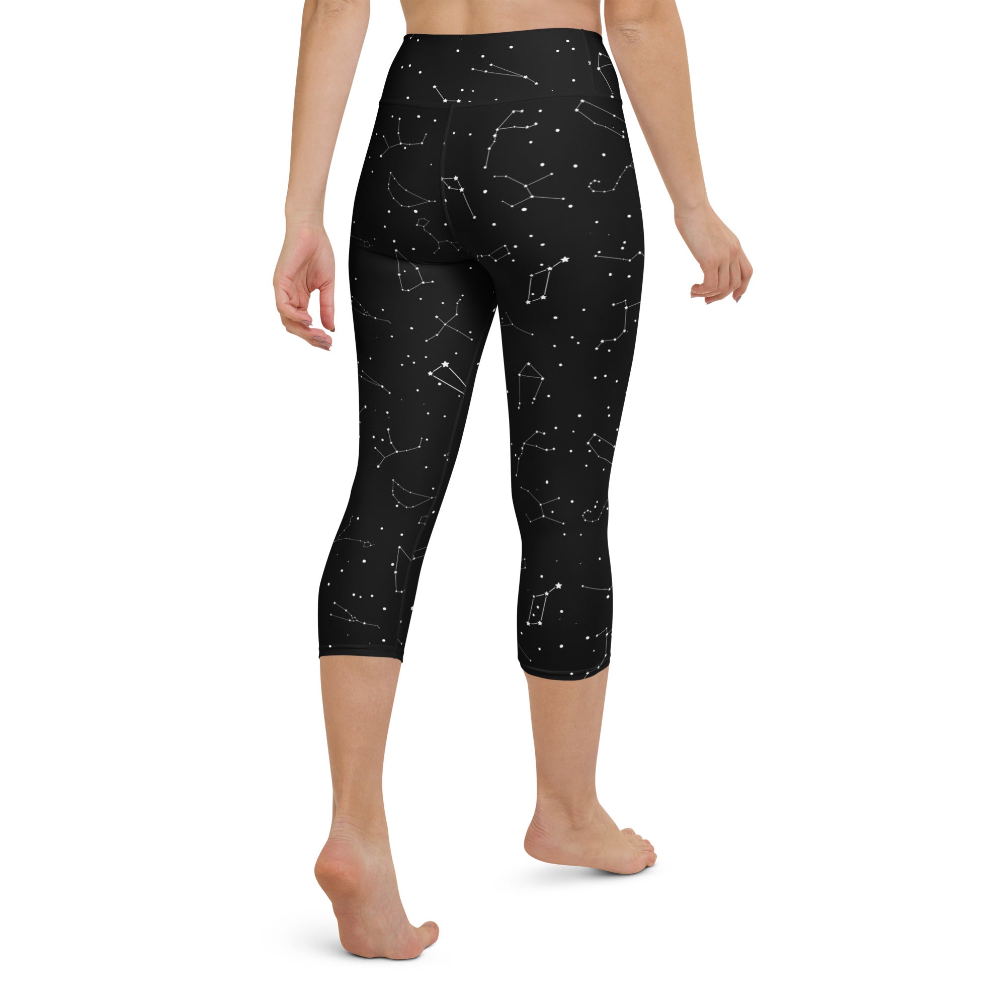 Women’s black butter soft high-rise yoga capri leggings with white realistic constellation pattern and moisture-wicking fabric