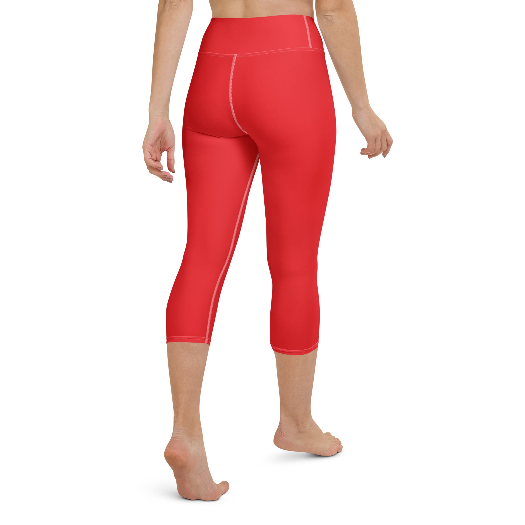 Women’s red high-rise buttery soft yoga capri leggings with subtle white stitching moisture-wicking stretch