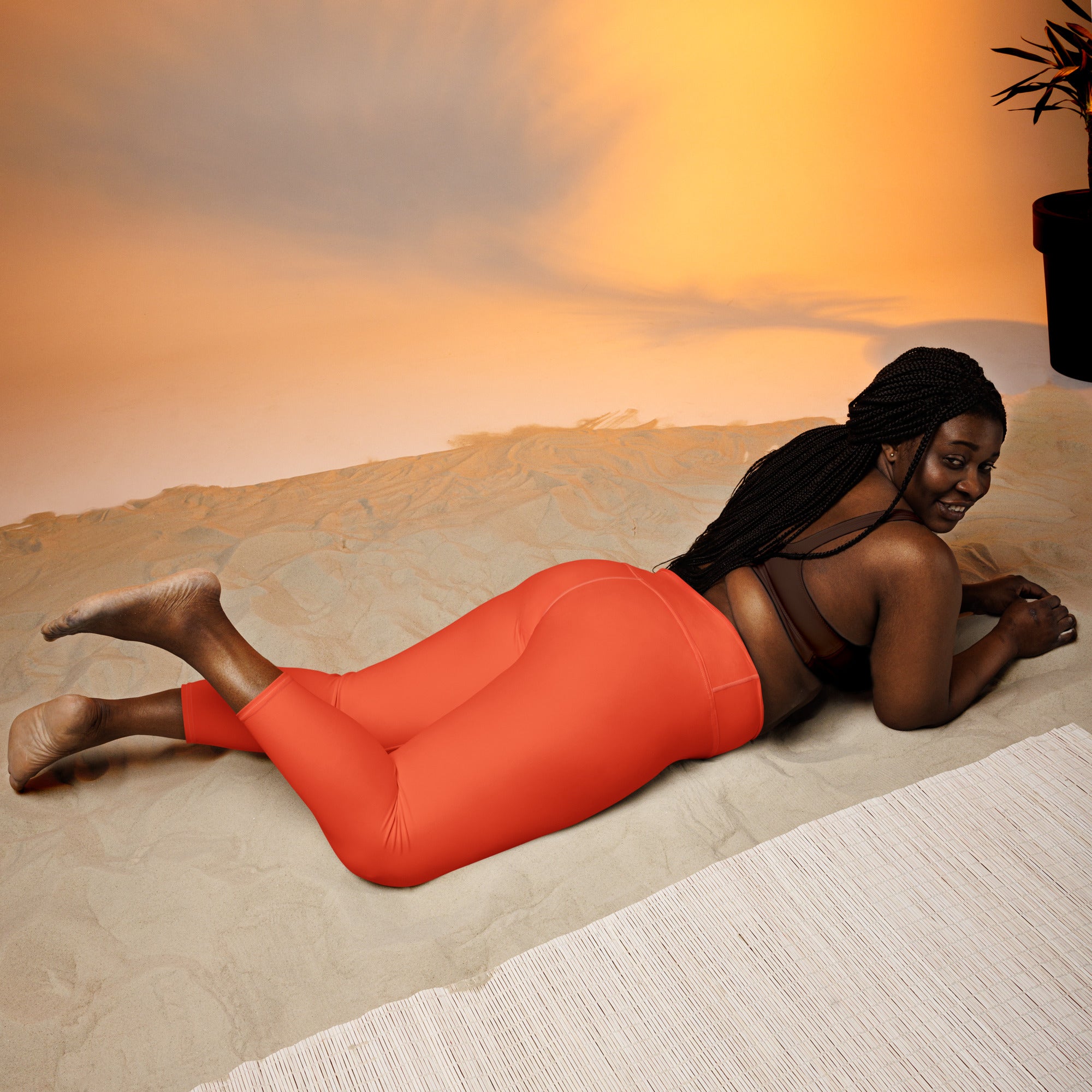 Vibrant orange high-rise buttery soft yoga capri leggings with moisture-wicking fabric and soft stretch for activewear