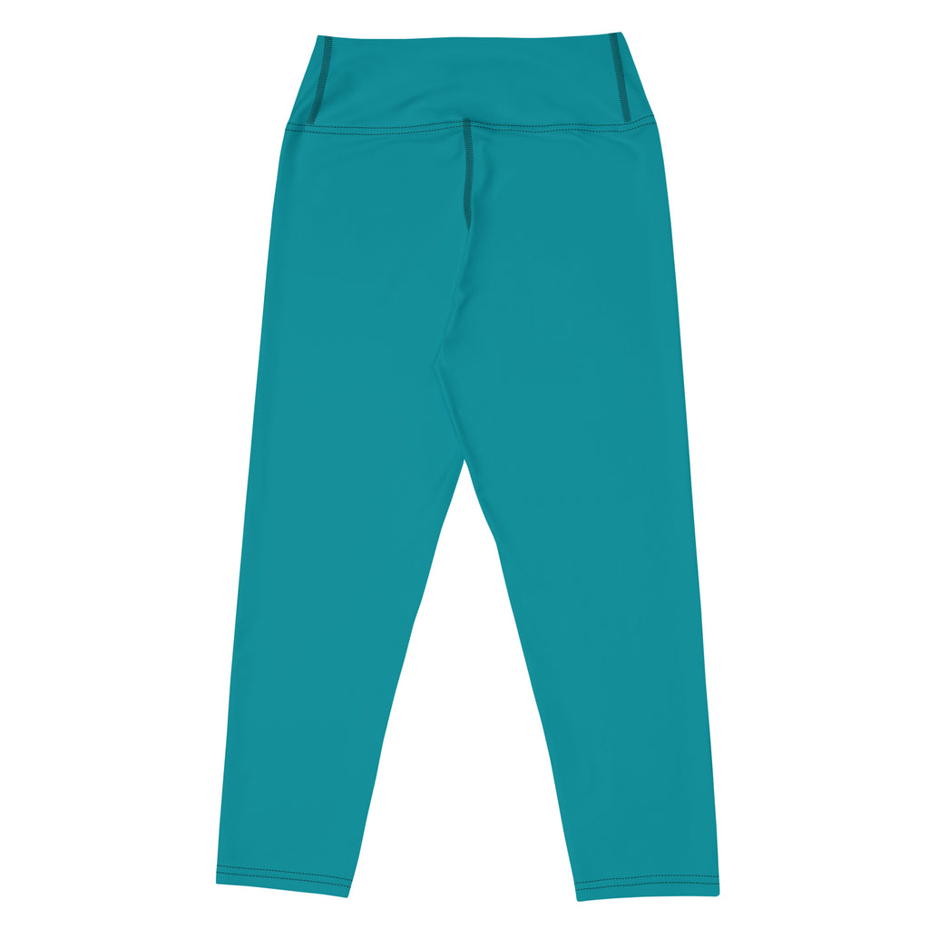 Women’s teal buttery soft yoga capri leggings with high-rise fit smooth stretchy fabric and subtle seam detailing