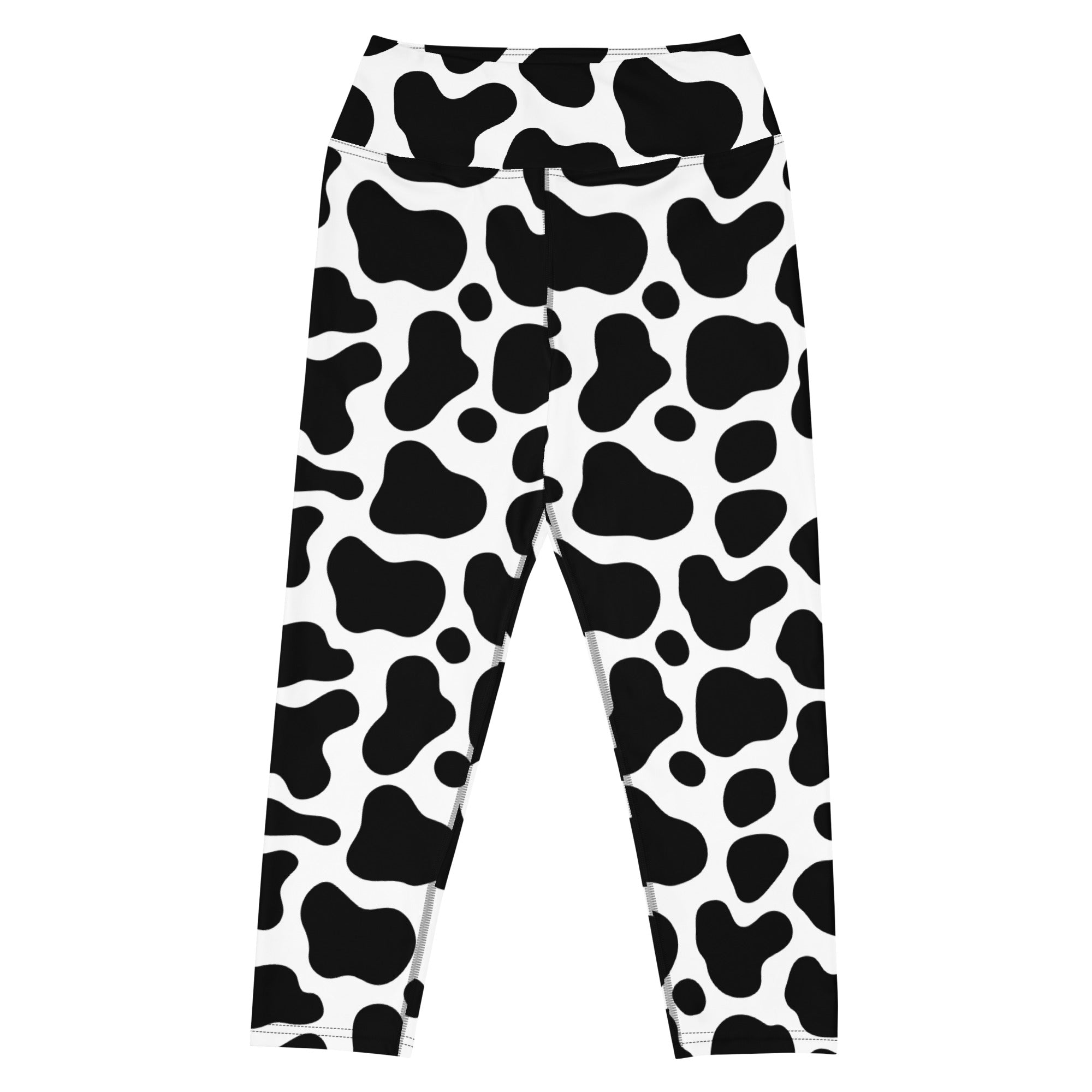 Women’s high rise black and white cow print buttery soft yoga capri leggings with moisture wicking stretch fabric