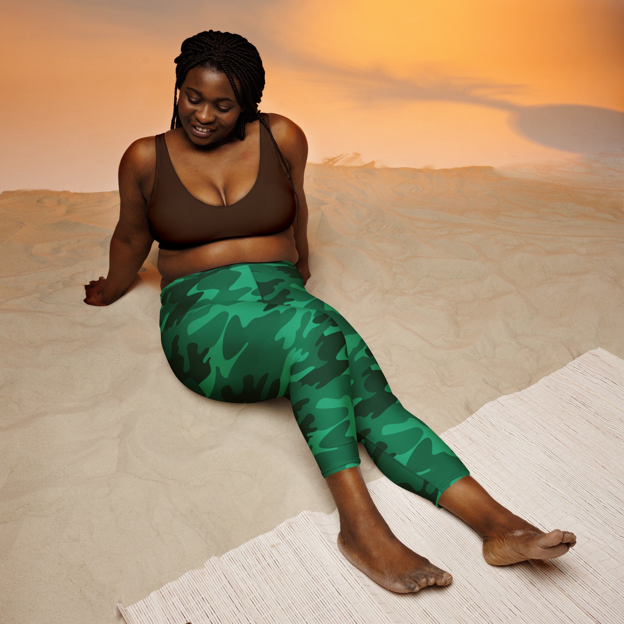 Women’s green camouflage buttery soft high-rise moisture-wicking yoga capri leggings shown from the back side