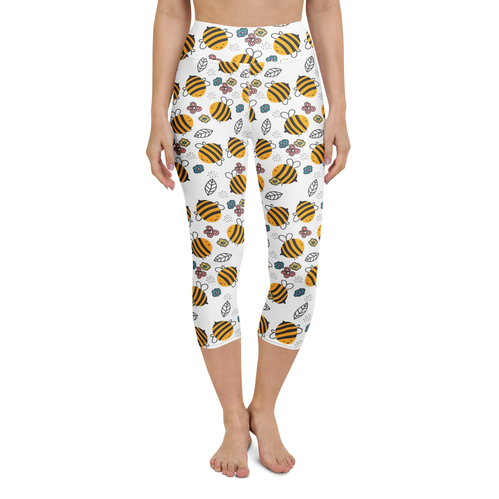 White high-rise buttery soft capri leggings with yellow bumblebee and floral pattern moisture-wicking stretch