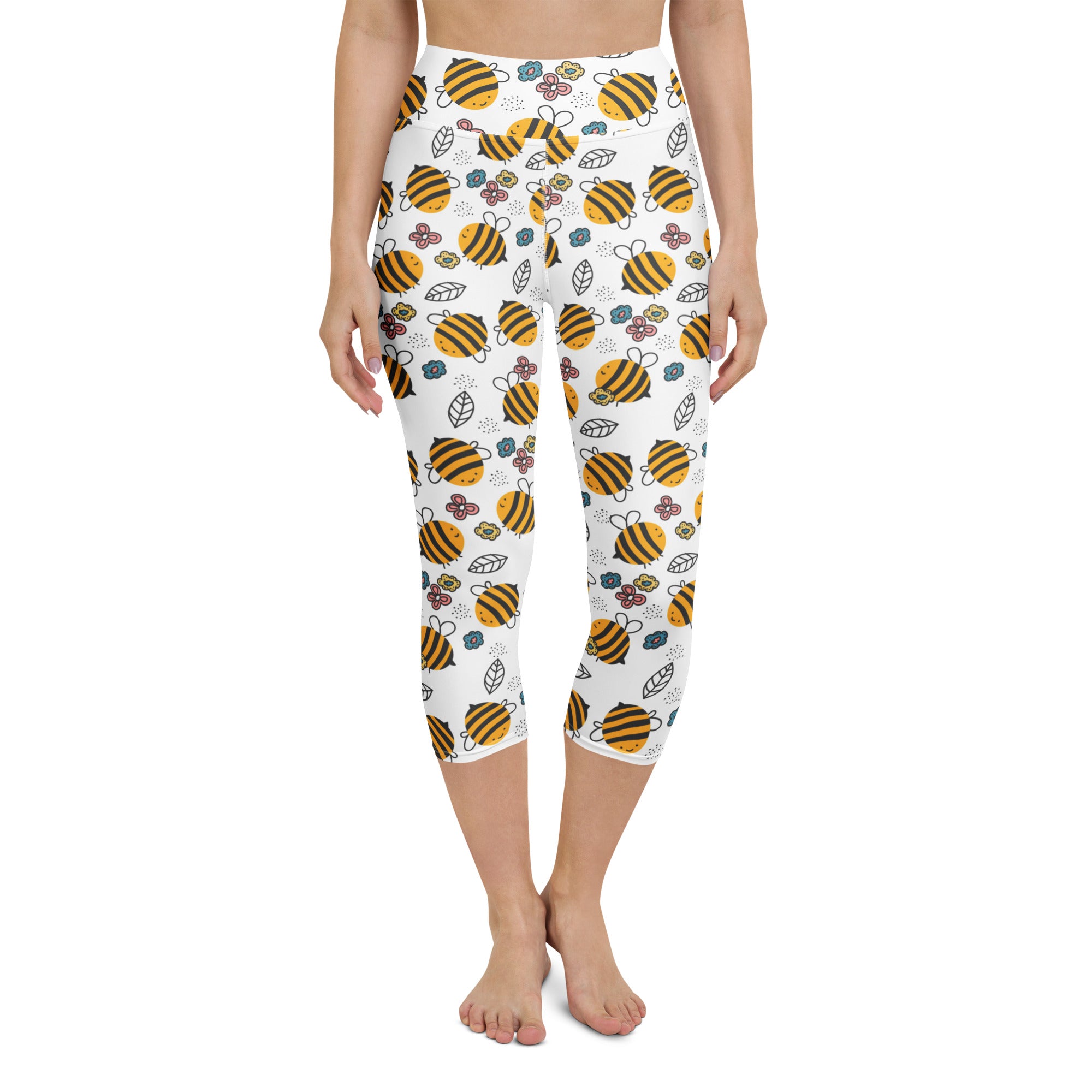 White high-rise buttery soft capri leggings with yellow bumblebee and floral pattern moisture-wicking stretch