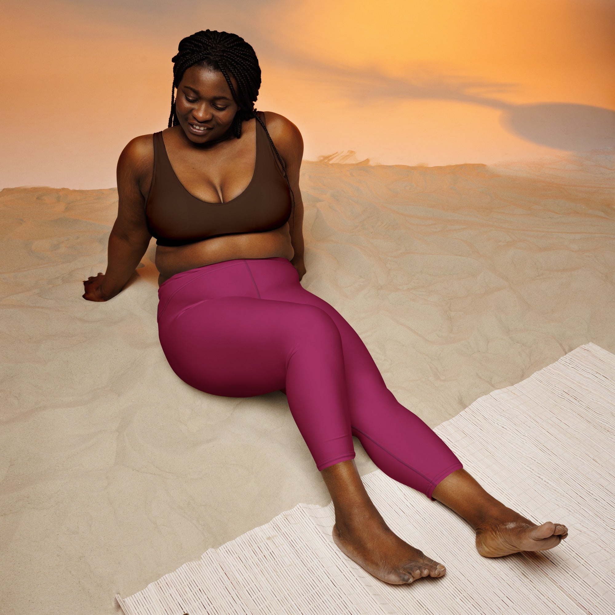 Fuchsia high-waisted yoga capri leggings made of buttery soft, moisture-wicking stretch fabric for activewear