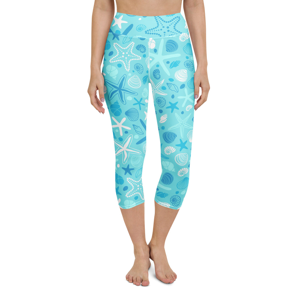 Women’s turquoise and white starfish and seashell patterned high-rise buttery soft moisture-wicking yoga capri leggings