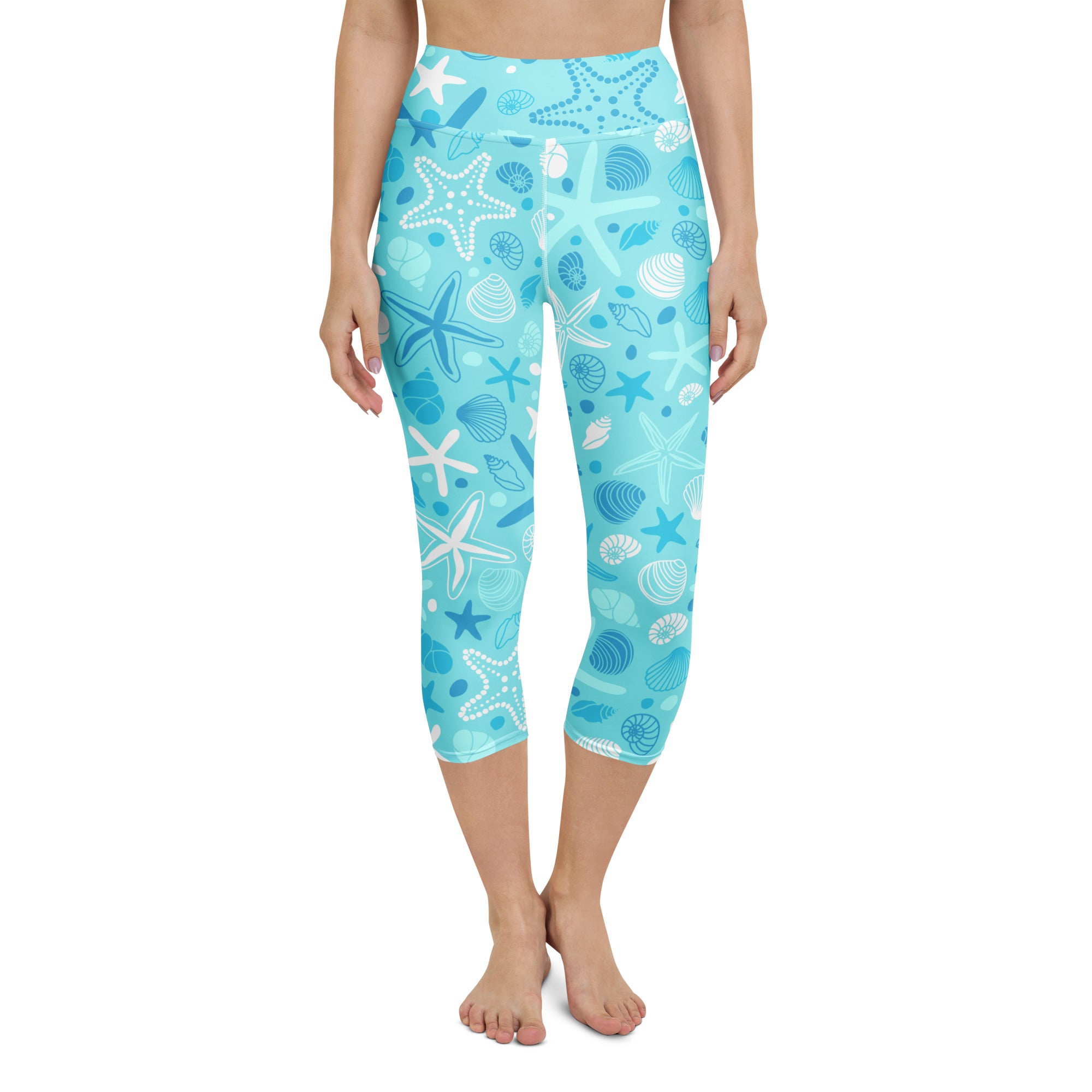 Women’s turquoise and white starfish and seashell patterned high-rise buttery soft moisture-wicking yoga capri leggings