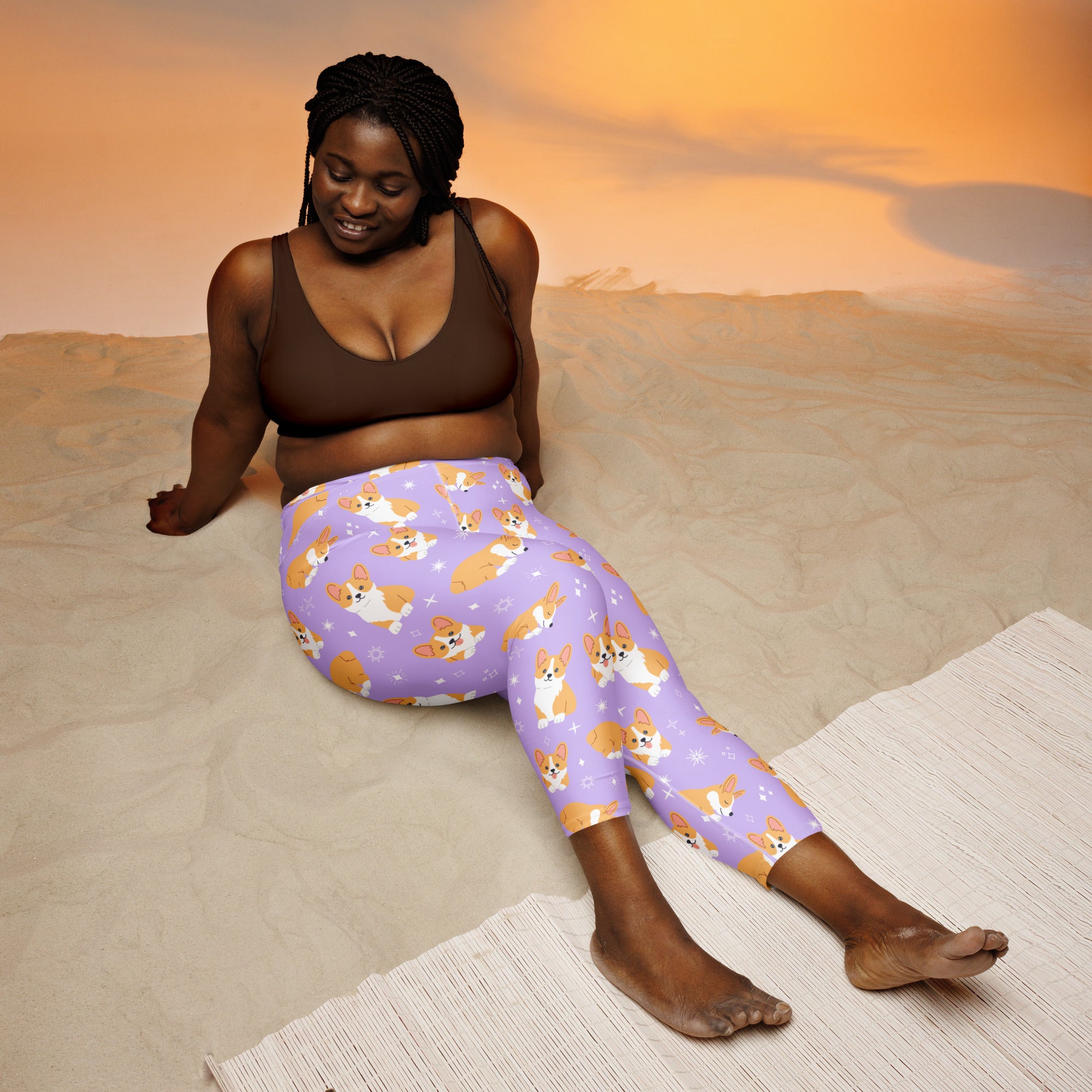 Women’s purple corgi dog buttery soft high-rise yoga capri leggings with moisture-wicking stretch fabric and playful pattern