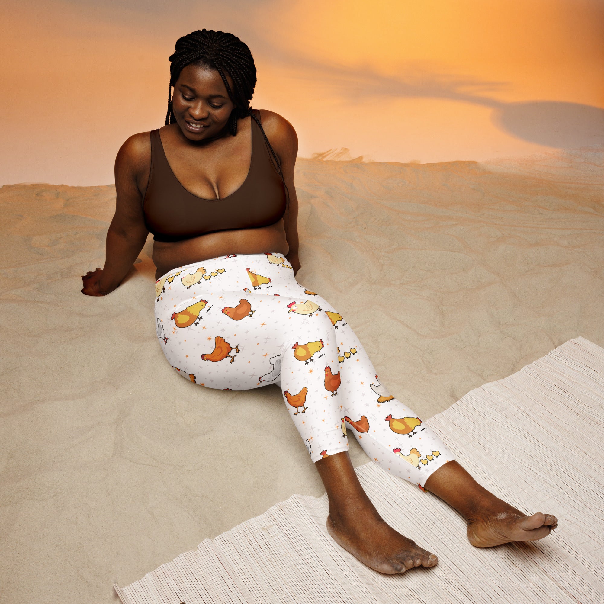 White high-rise buttery soft yoga capri leggings with orange and yellow cartoon chickens moisture-wicking stretch