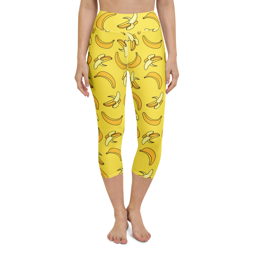 Women’s yellow buttery soft high-rise yoga capri leggings with playful banana pattern and moisture-wicking fabric