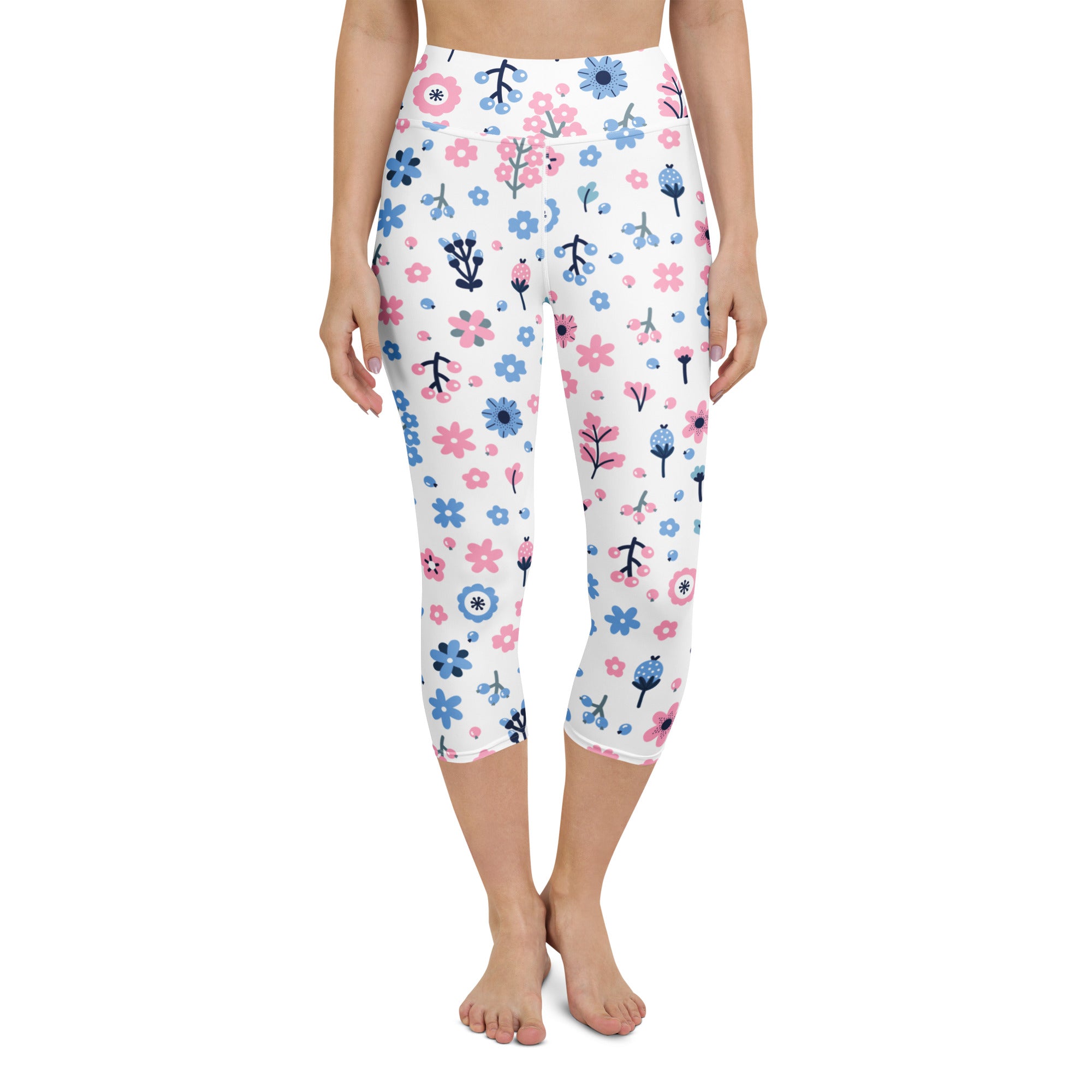 White capri leggings with pink and blue floral pattern featuring green stems high-rise moisture-wicking soft stretch