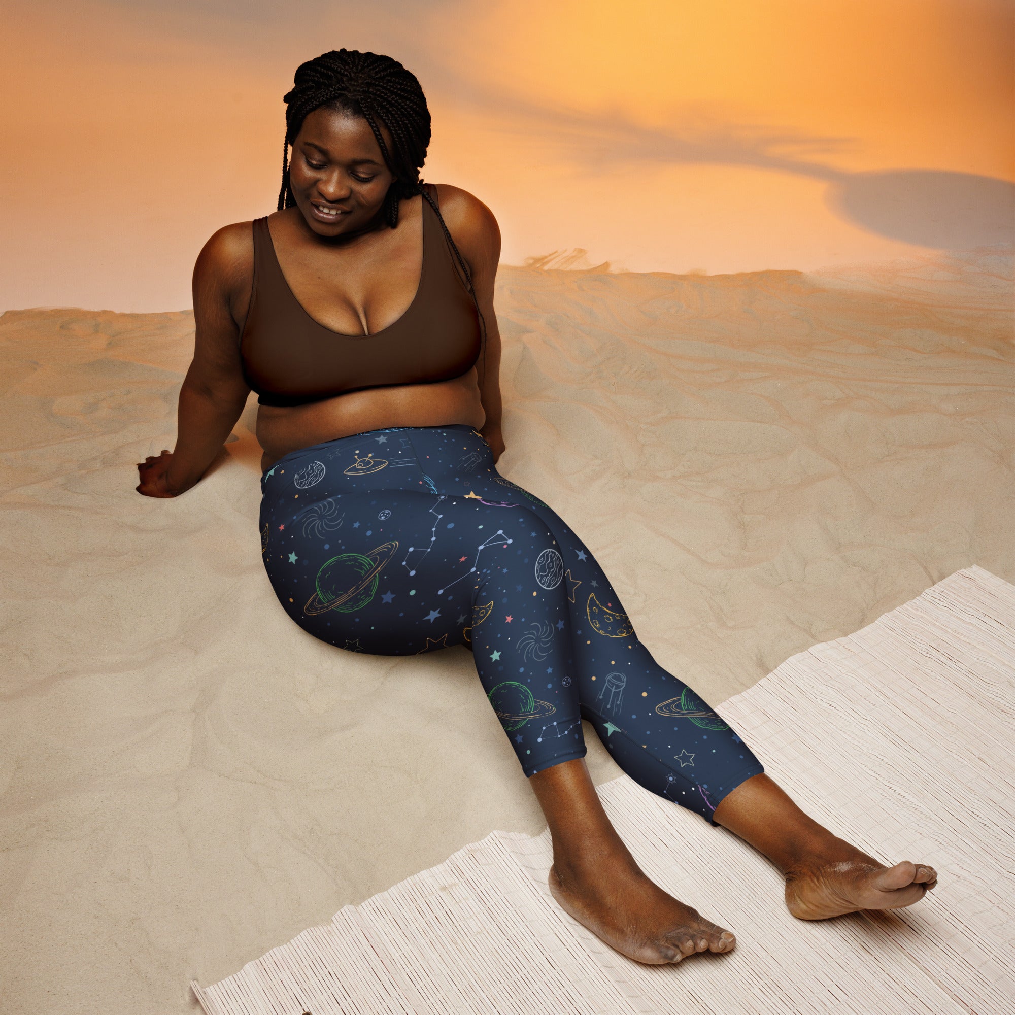 Dark blue high-rise women’s galaxy space buttery soft yoga capri leggings with pastel planet star and constellation designs