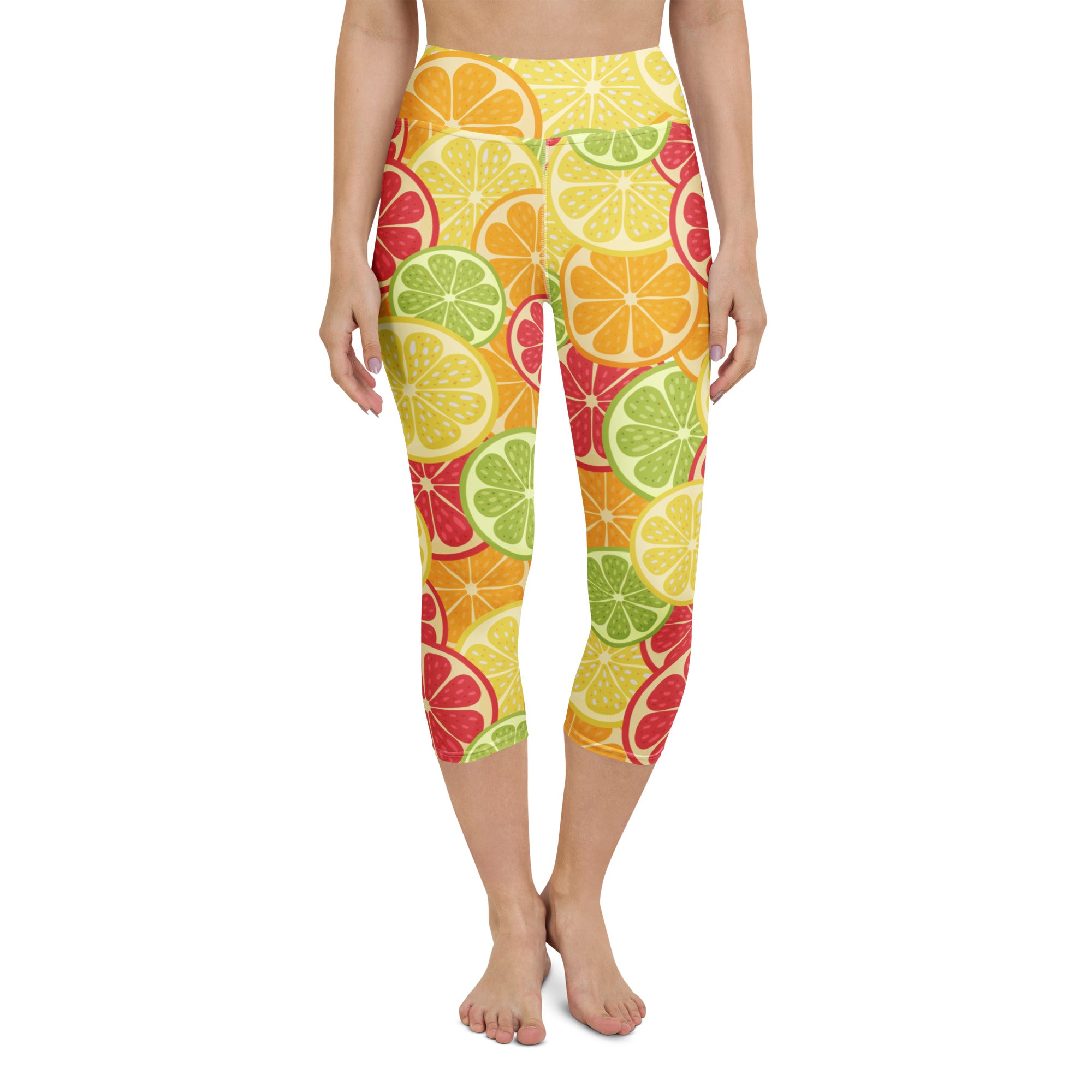 Women’s high-rise buttery soft yoga capri leggings with vibrant citrus fruit slice pattern in yellow green and red