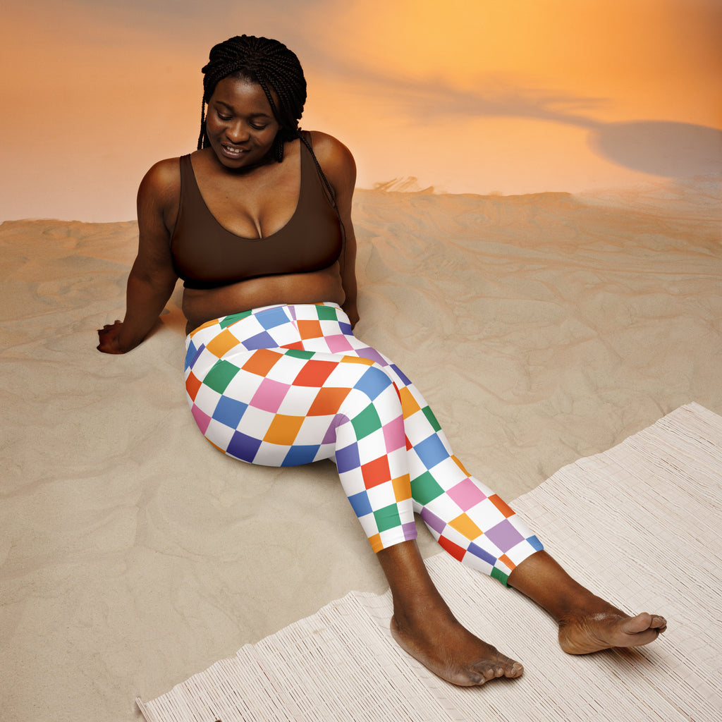 Women’s colorful checkered buttery soft high-rise yoga capri leggings with vibrant rainbow pattern on white base