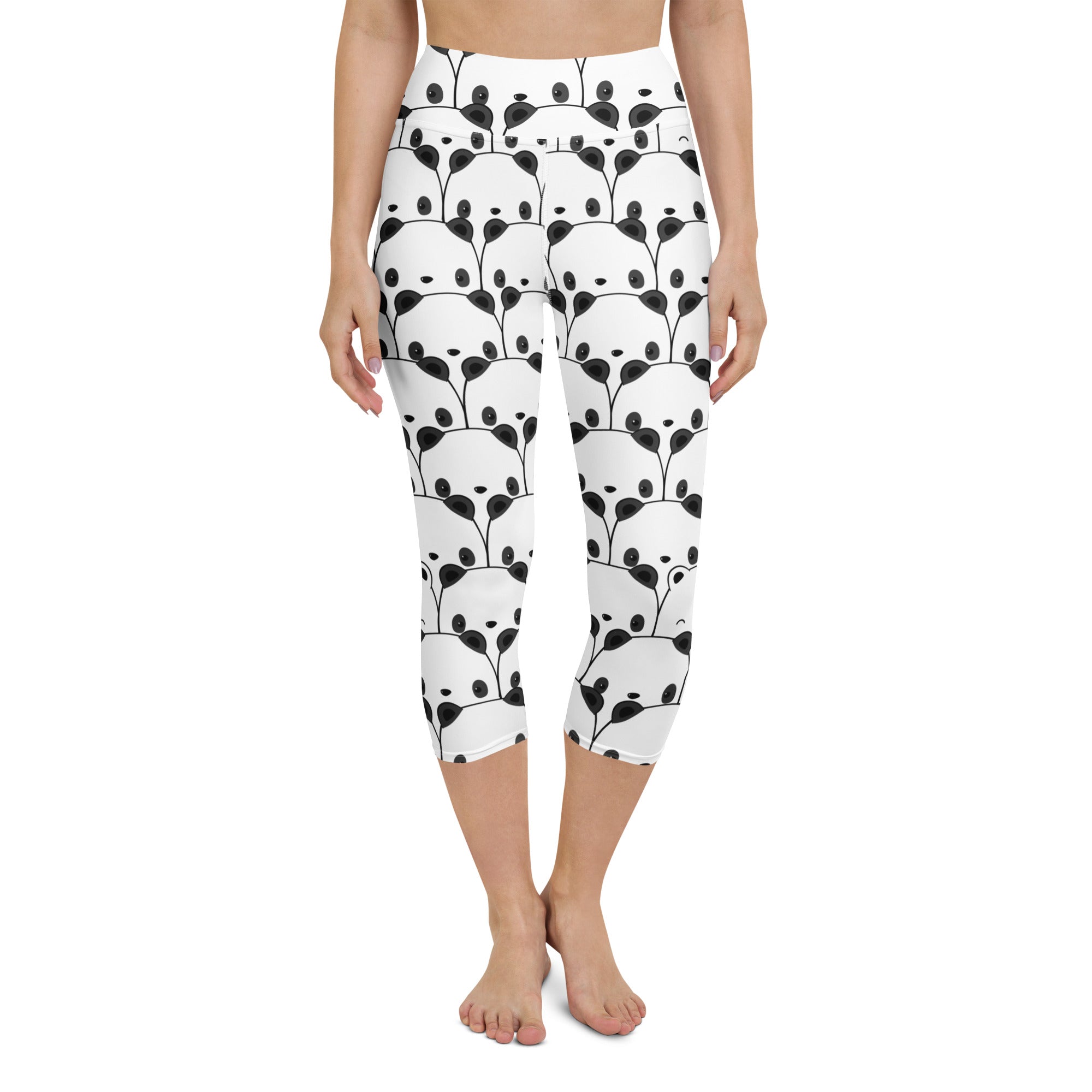 White high-rise capri leggings with moisture-wicking soft stretch fabric featuring black panda face and leafy print