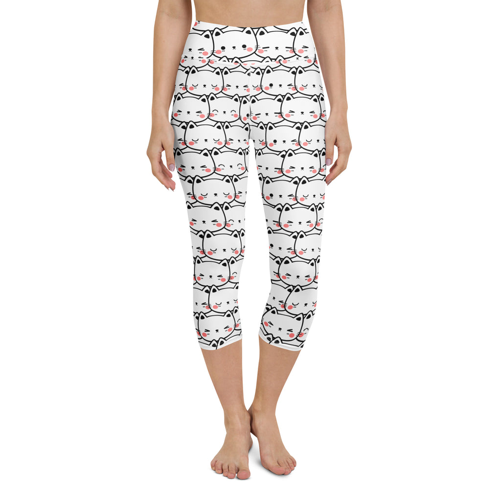 White high-rise capri leggings with black outlined cartoon cats and pink blush cheeks buttery soft moisture-wicking