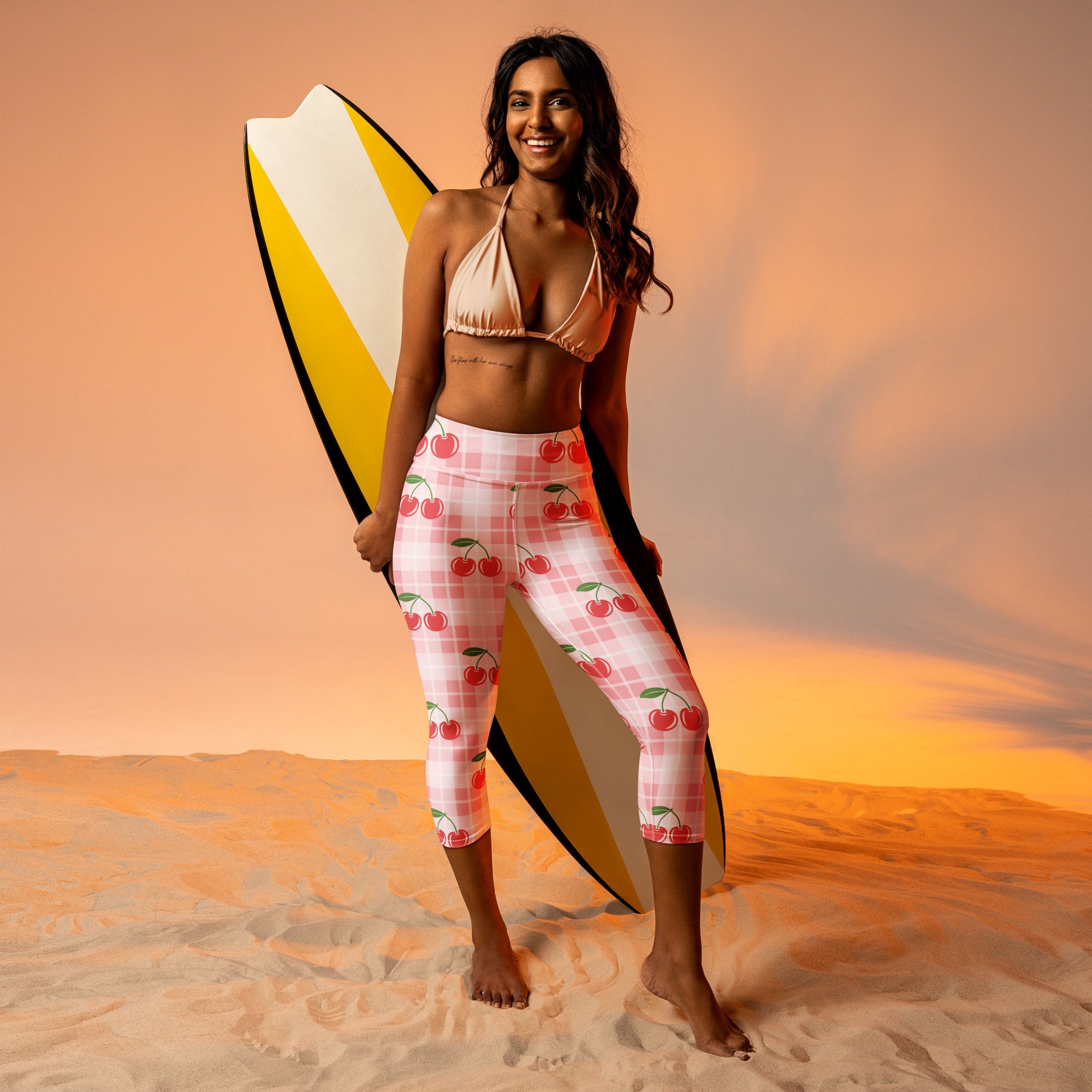 Women’s high-rise cherry print gingham capri leggings in pink and white with buttery soft moisture-wicking fabric