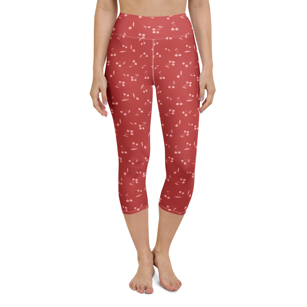 Women’s high-rise red cherry capri leggings made of buttery soft moisture-wicking fabric for yoga and activewear