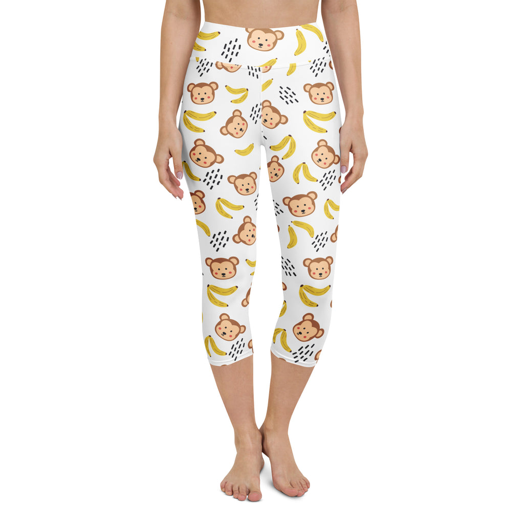 Women’s white high-rise monkey buttery soft yoga capri leggings with brown cartoon monkeys and yellow bananas pattern