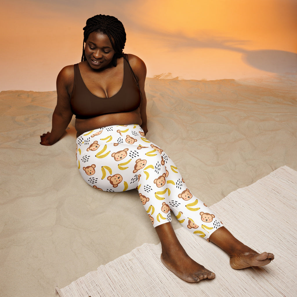White womens monkey buttery soft yoga capri leggings with brown bear and yellow banana pattern and black raindrop accents