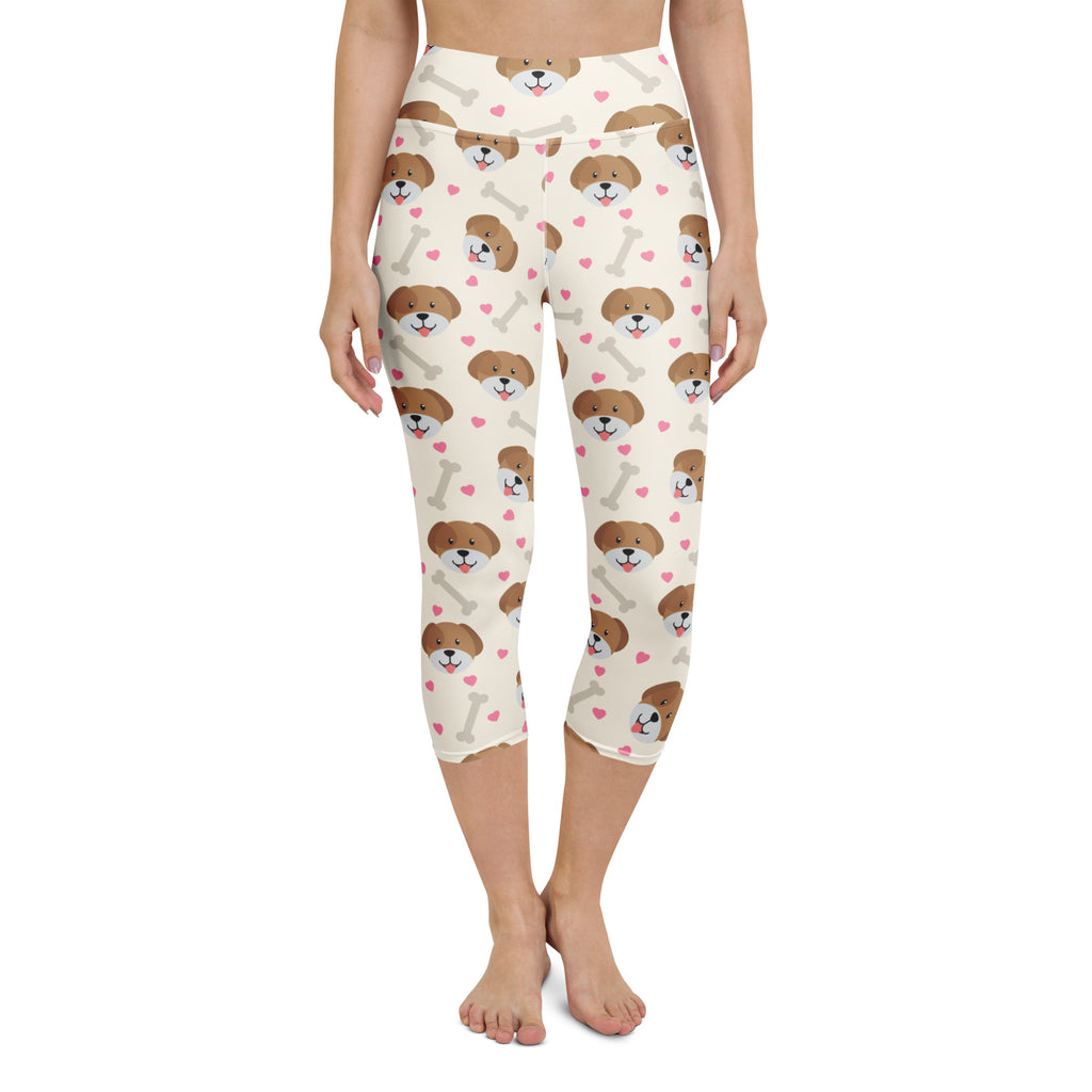 Cream-colored women’s puppy and bone buttery soft high-rise capri leggings with moisture-wicking stretch fabric and playful pattern