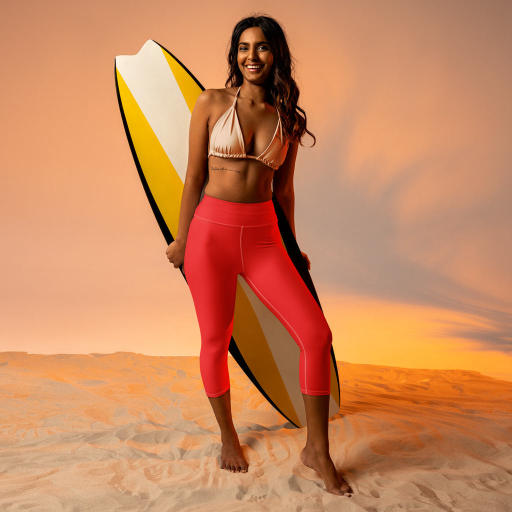 Women’s coral high-waisted surf leggings with soft stretch, moisture-wicking fabric for active yoga wear
