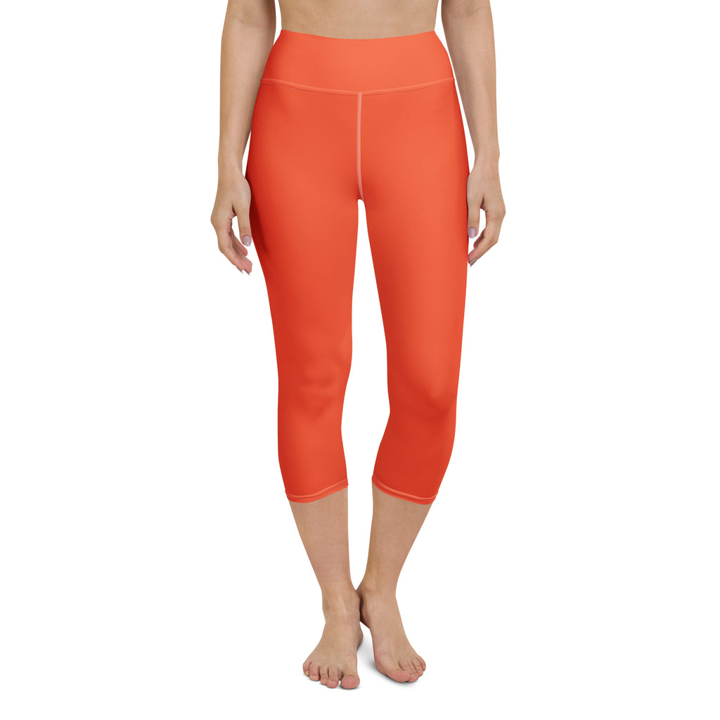 Women’s orange buttery soft high-rise capri leggings with smooth stretchy moisture-wicking fabric for yoga