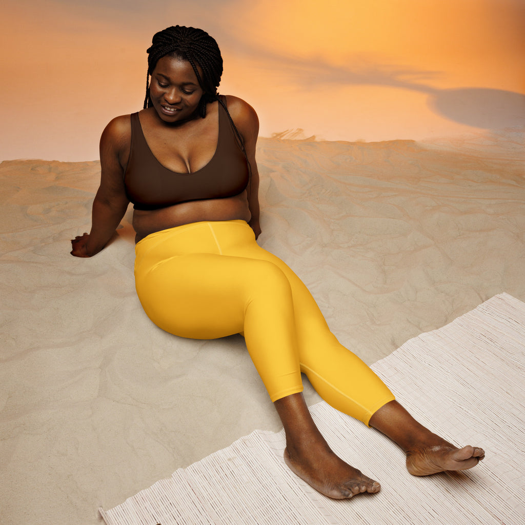 Bright yellow high-rise buttery soft yoga capri leggings with moisture-wicking soft stretch fabric for activewear