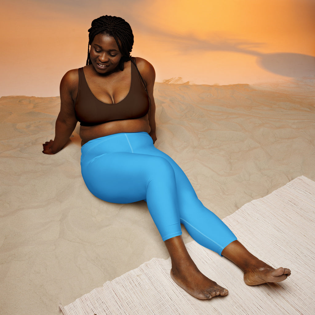 Bright blue high-waisted buttery soft yoga capri leggings with moisture-wicking fabric for activewear use
